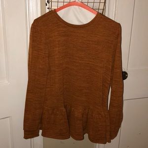 Burnt orange sweater.